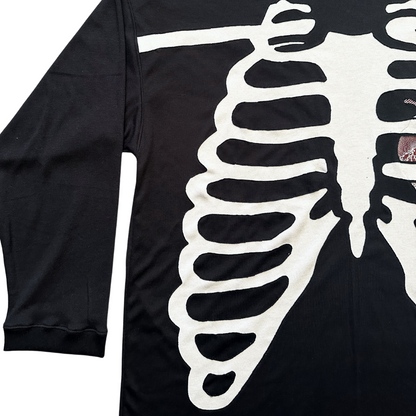 Unapologetic Youth long sleeve Bones shirt featuring a graphic design with bones, black fabric, and casual fit.
