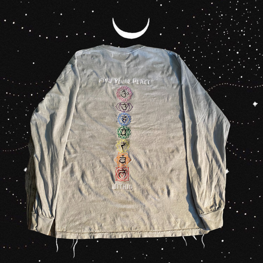 Unapologetic Youth Inner Awakening long sleeve shirt with bold graphic design on black fabric.