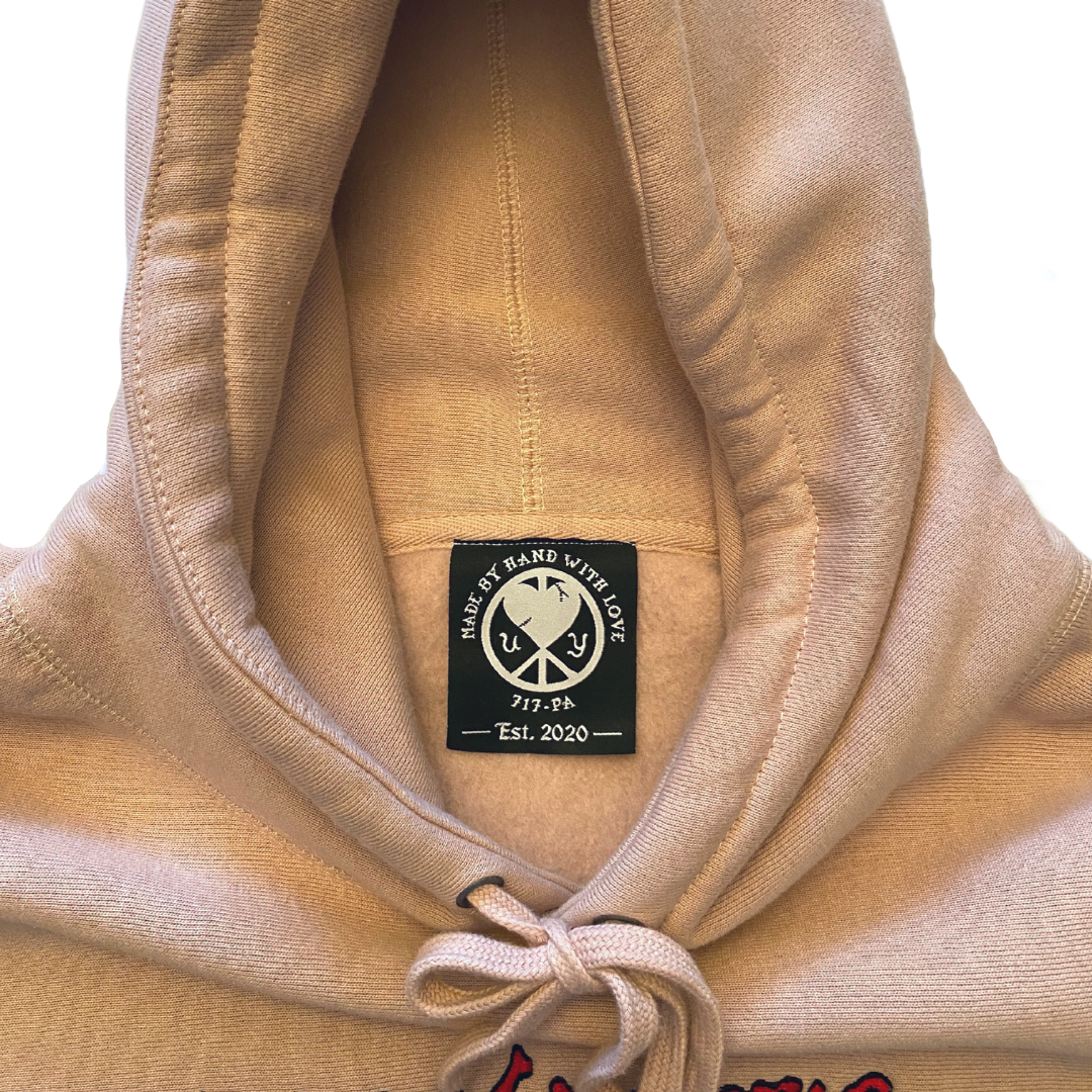 Unapologetic Youth Bleeding Love hoodie featuring a graphic design with red and black artwork on soft fabric.