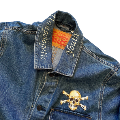 Unapologetic Youth denim jean jacket with bones design, featuring classic fit and distressed details, casual and stylish outerwear.