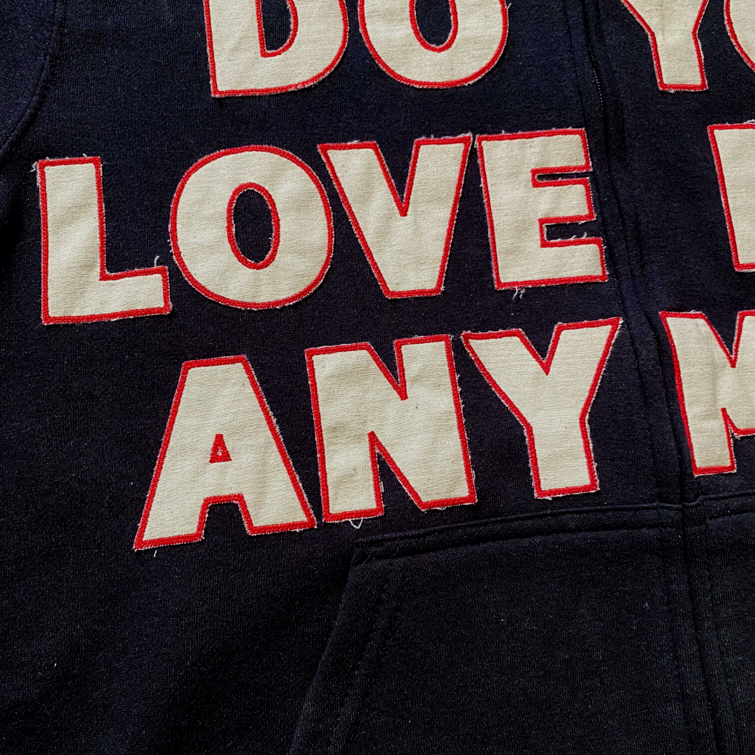 Unapologetic Youth Always & Forever large zip-up hoodie in black, featuring a front zipper and casual style.