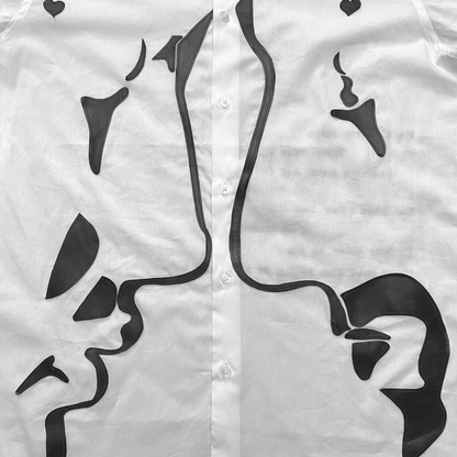 Unapologetic Youth button-down shirt featuring a faces pattern, showcased on a mannequin with long sleeves and a collar.