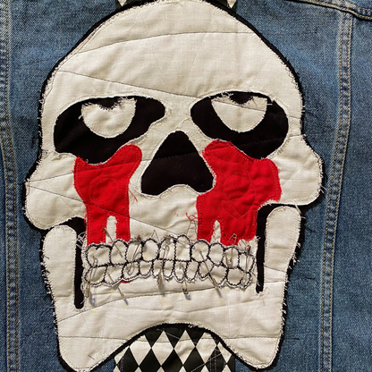 Unapologetic Youth Torn large/XL denim jacket with distressed details and classic fit, shown on a hanger.