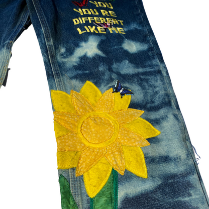 Dark blue Unapologetic Youth jeans with classic five-pocket design and straight-leg fit, shown on a model.