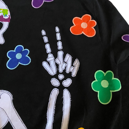 Unapologetic Youth Hippie Dreams hoodie with colorful tie-dye pattern and relaxed fit, displayed on a hanger.