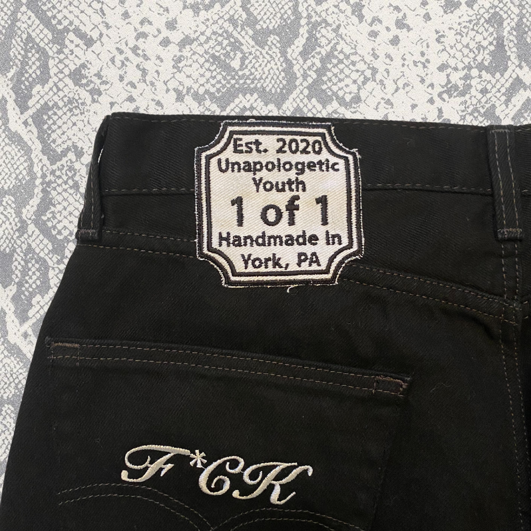 Unapologetic Youth "To The Bone" jeans featuring classic blue denim, high waist, and distressed details, front view.