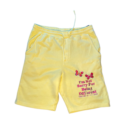 Unapologetic Youth shorts in black with adjustable drawstring waist and side pockets, casual and comfortable for everyday wear.