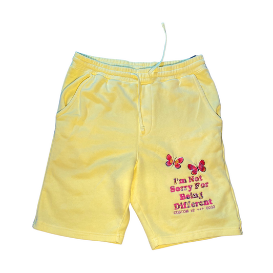 Unapologetic Youth shorts in black with adjustable drawstring waist and side pockets, casual and comfortable for everyday wear.