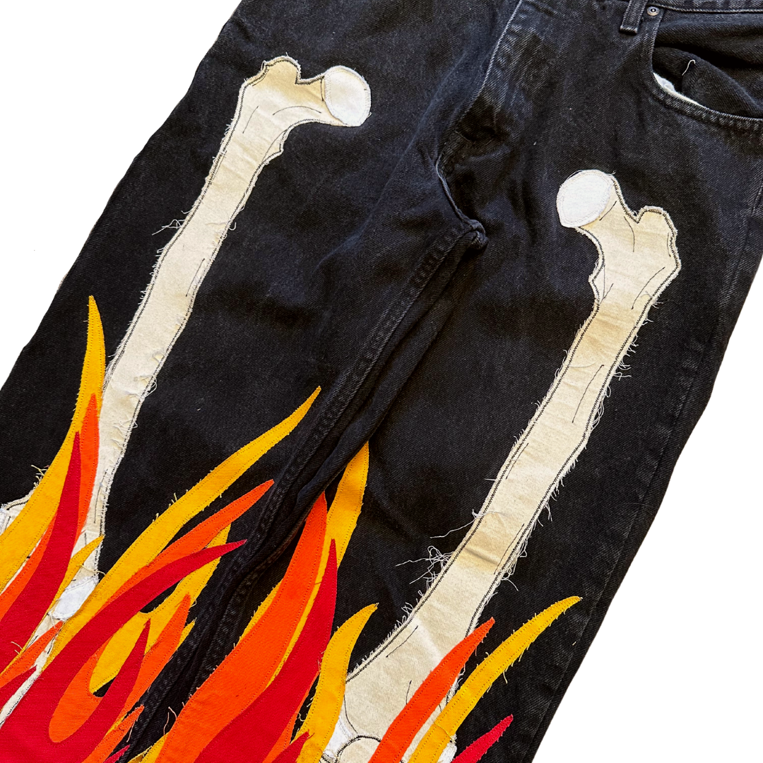 Unapologetic Youth Bones jeans in denim, featuring a classic fit with distressed details and visible stitching.
