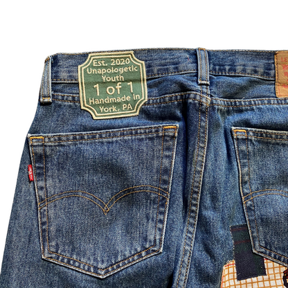 Unapologetic Youth Peaceful Cowboy 32x32 jeans, showcasing classic denim with detailed stitching and a relaxed fit.