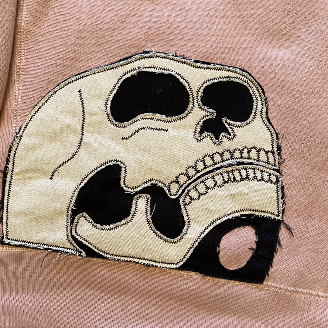 Unapologetic Youth Bleeding Love hoodie featuring a bold graphic design and comfortable fit, displayed on a hanger.
