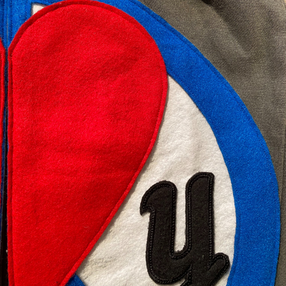 Unapologetic Youth Split Logo sweatpants with stylish side panel design and comfortable fit, perfect for casual wear.