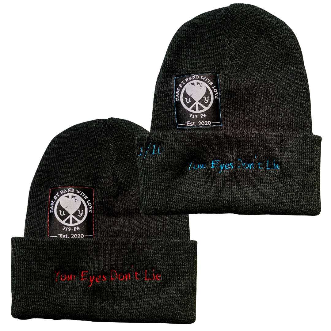 Unapologetic Youth All Seeing Eyes beanie featuring a bold eye design in black and white, cozy knit fabric for casual style.