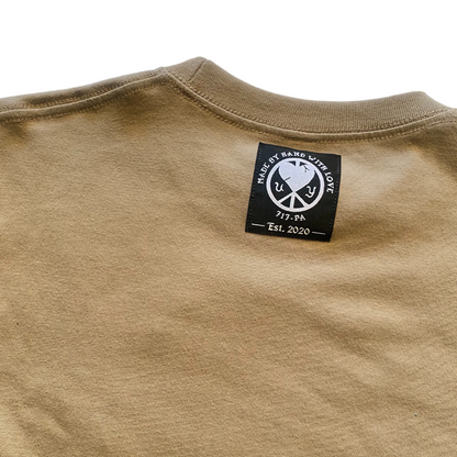 Large natural-colored Unapologetic Youth T-shirt displayed flat with visible neckline and short sleeves.