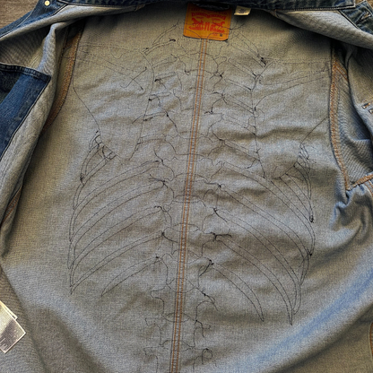 Unapologetic Youth denim jean jacket with bones design, casual fit, featuring classic collar and button closure.