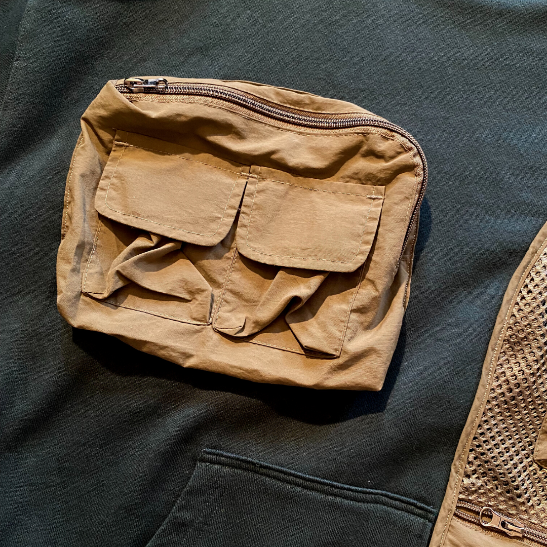 Unapologetic Youth large tactical hoodie with durable fabric, featuring a hood, drawstrings, and tactical design elements.