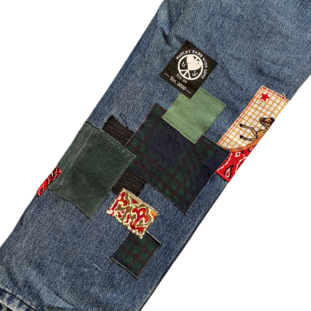Unapologetic Youth Peaceful Cowboy 32x32 jeans with classic denim wash and detailed stitching, shown on a plain background.