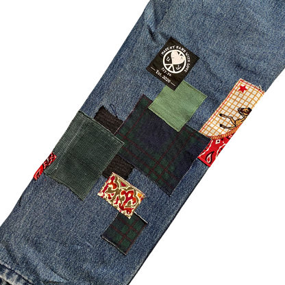 Unapologetic Youth Peaceful Cowboy 32x32 jeans with classic denim wash and detailed stitching, shown on a plain background.
