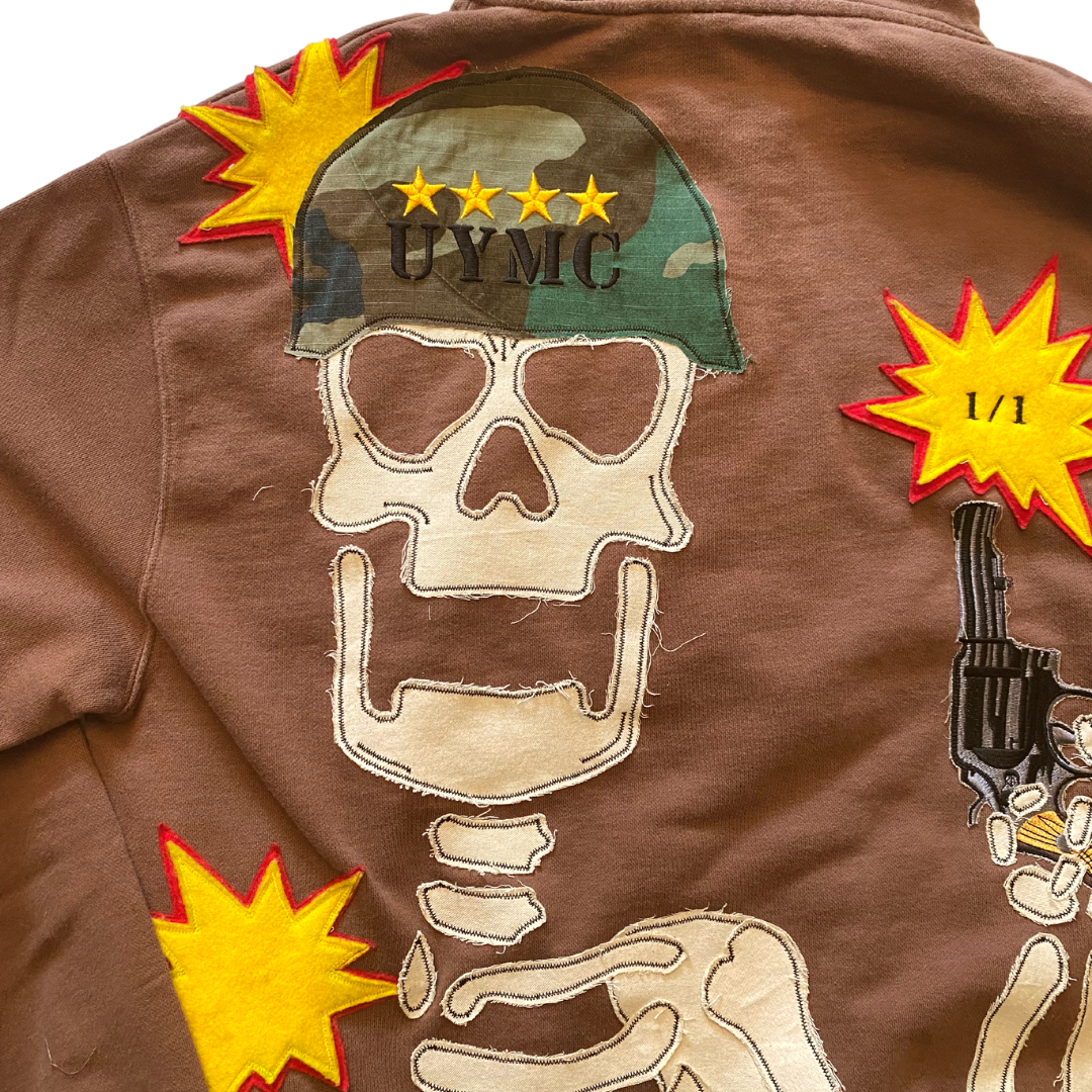 Unapologetic Youth War Torn hoodie featuring distressed fabric and bold graphic design, front view showing detailed print and hoodie details.