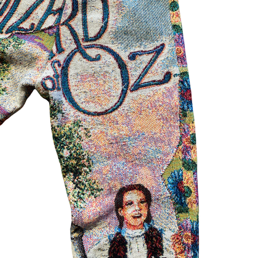 Unapologetic Youth Wonderful Wizard woven pants with colorful, intricate patterns and a comfortable fit, displayed on a hanger.