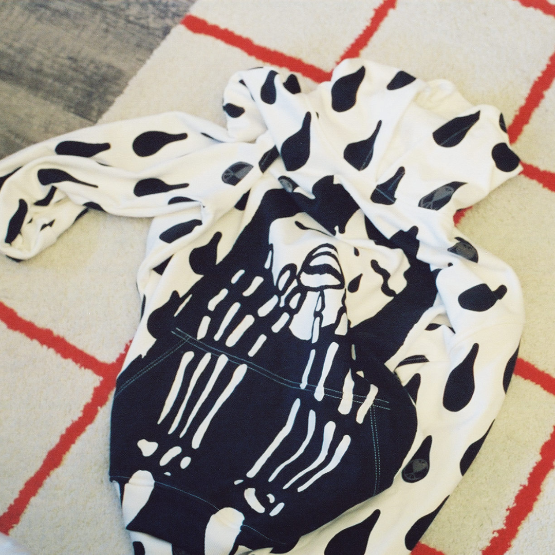 Unapologetic Youth Rain On My Skin hoodie featuring a rain-inspired graphic design in black and gray on soft fabric.
