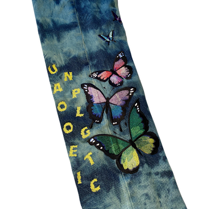 Unapologetic Youth jeans shown on a model, featuring a classic blue denim fit with visible stitching and five-pocket design.