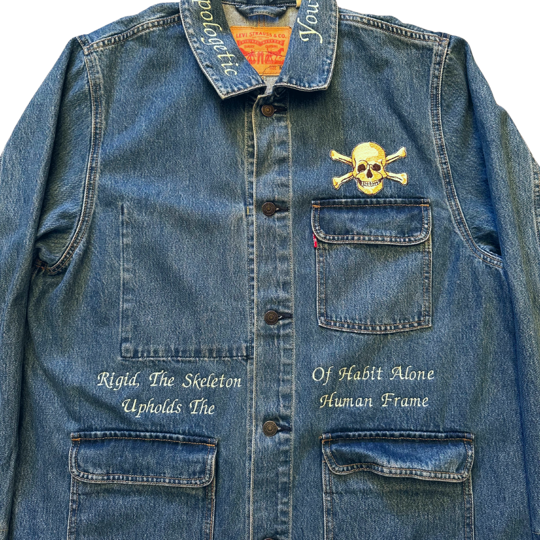 Unapologetic Youth Bones jean jacket with classic denim design, featuring front pockets and button closure.