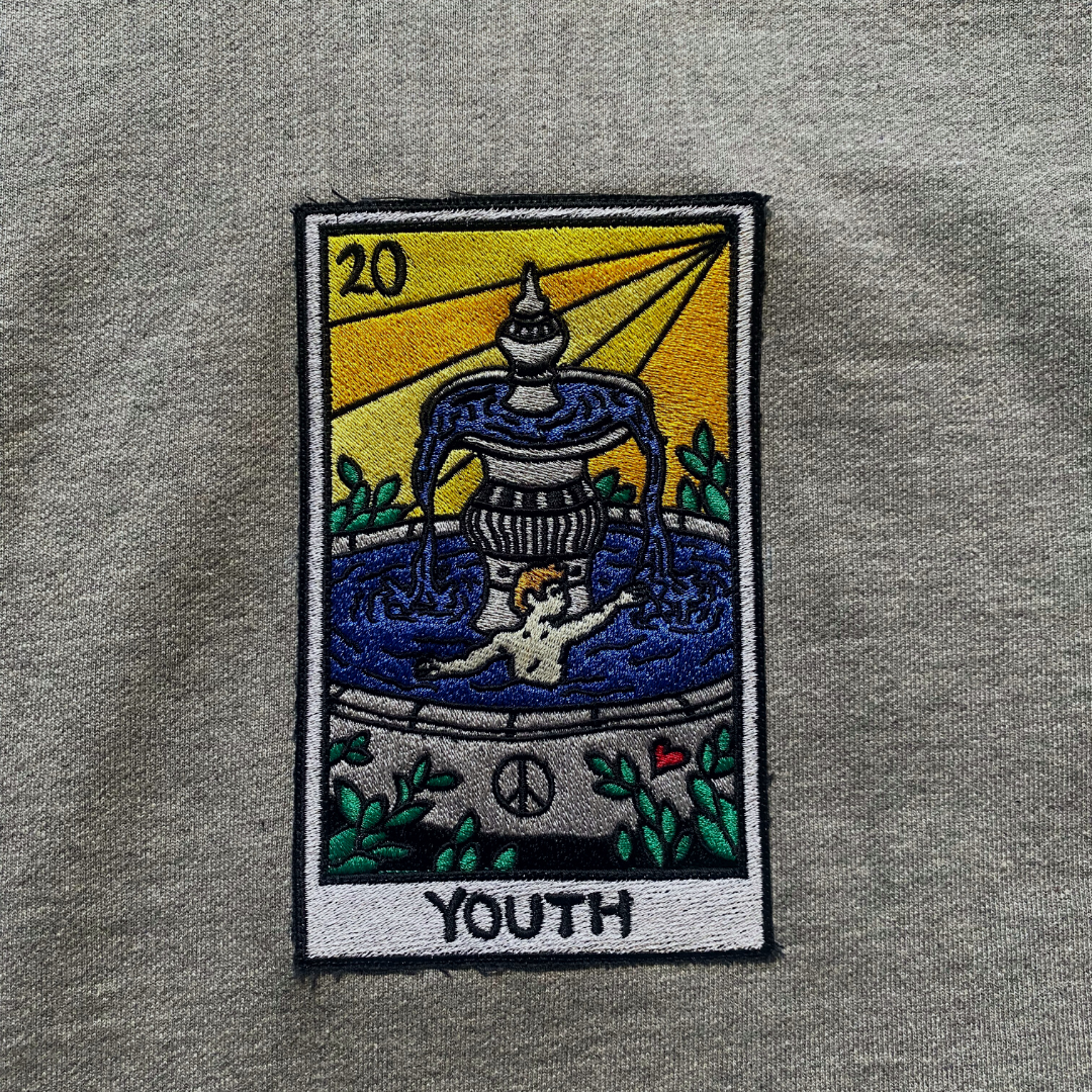 Unapologetic Youth Tarot Reader hoodie featuring a youthful design, with comfortable fabric and tarot-themed graphics on the front.