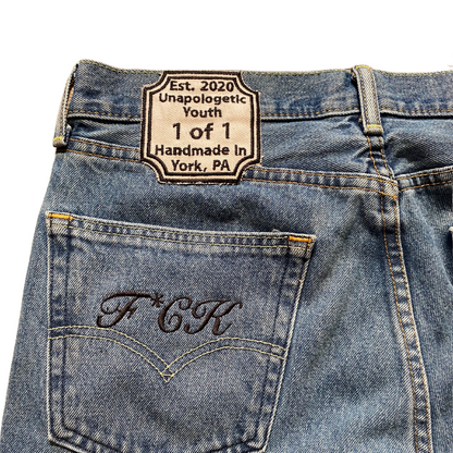 Blue denim jeans from Unapologetic Youth x Levi's "To The Bone" collection, showcasing classic fit and detailed stitching.