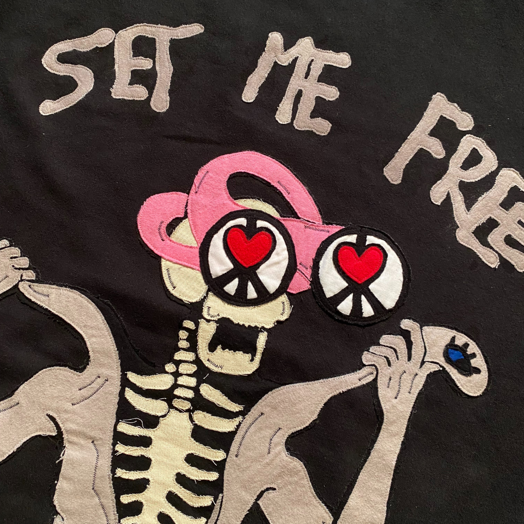Unapologetic Youth Set Me Free XL hoodie in black with white text, soft fabric, and front pocket design.