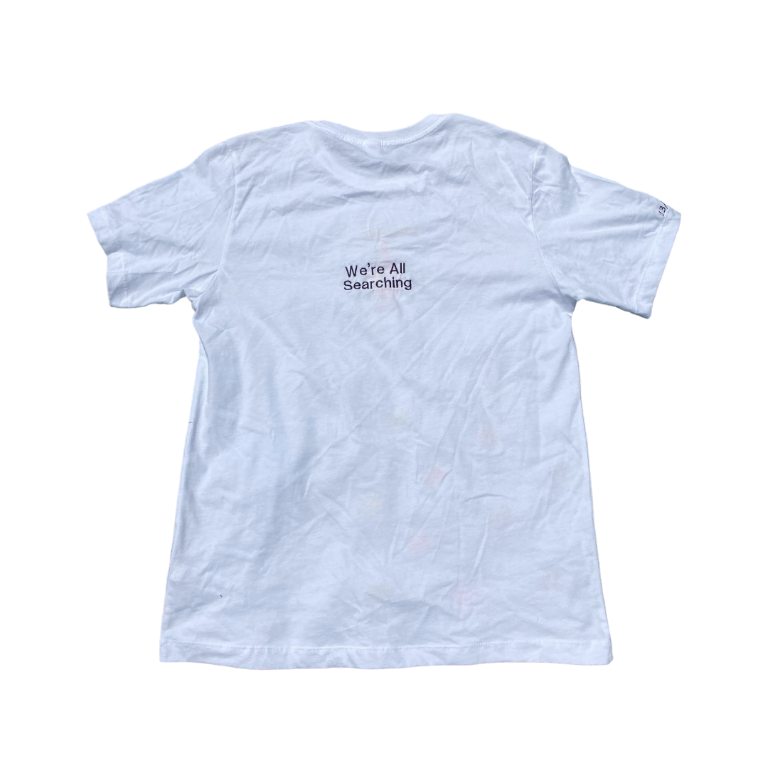 Unapologetic Youth flamethrower graphic t-shirt showing a fiery flamethrower illustration on the back.