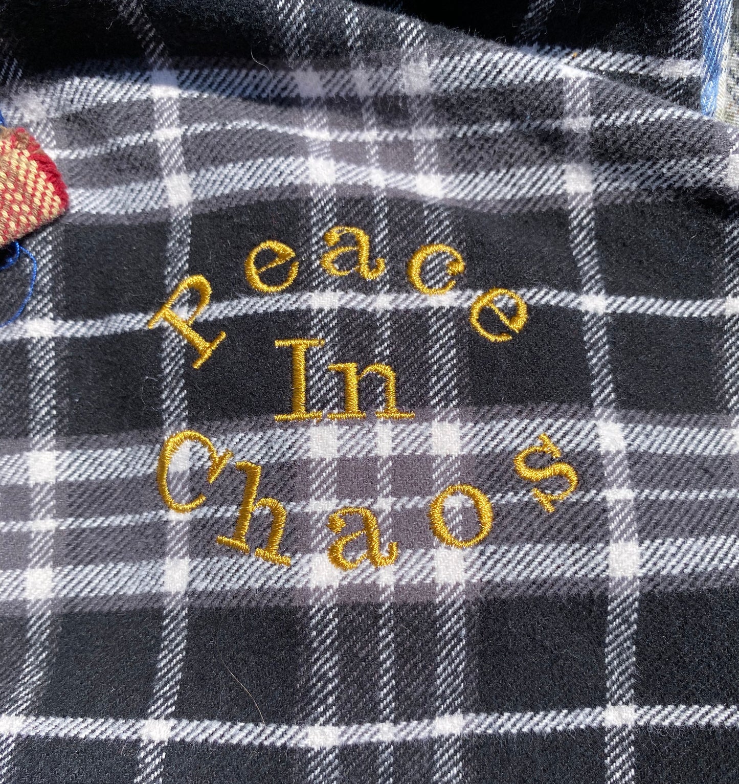 Unapologetic Youth Mix N' Match flannel shirt in various colors, showing a close-up of the soft, plaid fabric and button details.