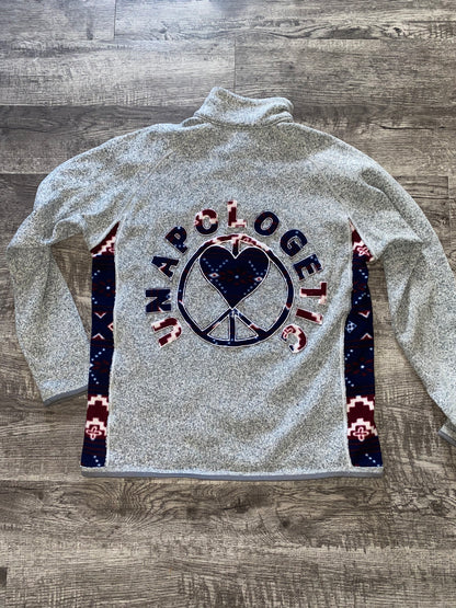 Unapologetic Youth x Patagonia fleece jacket in gray with front zipper and logo patch, casual outdoor wear.