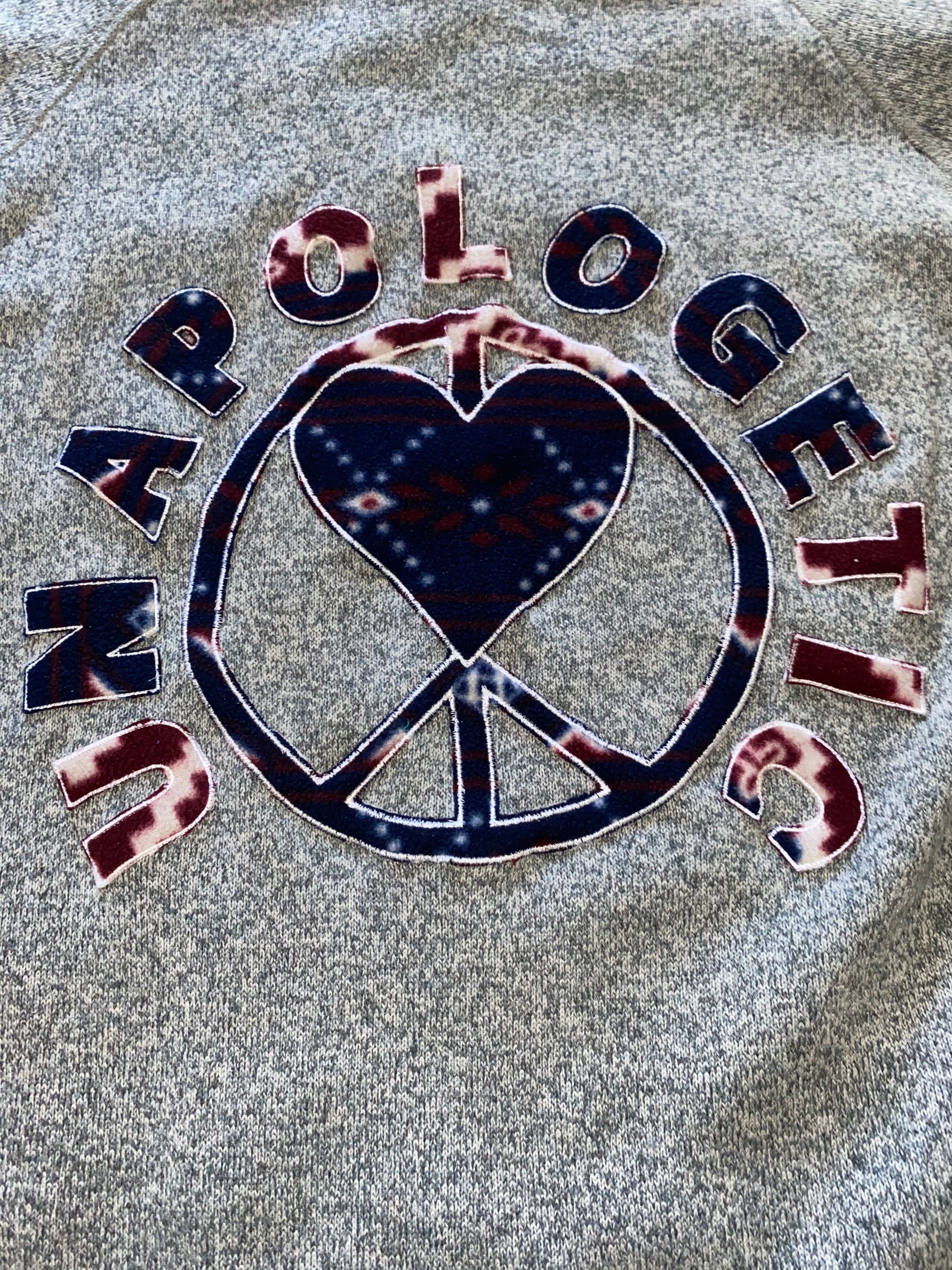 Unapologetic Youth x Patagonia fleece jacket in black, showing its cozy fabric and stylish design.