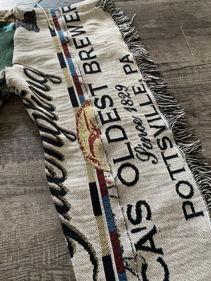Unapologetic Youth woven pants in Yuengling design, featuring a casual fit and detailed fabric pattern.