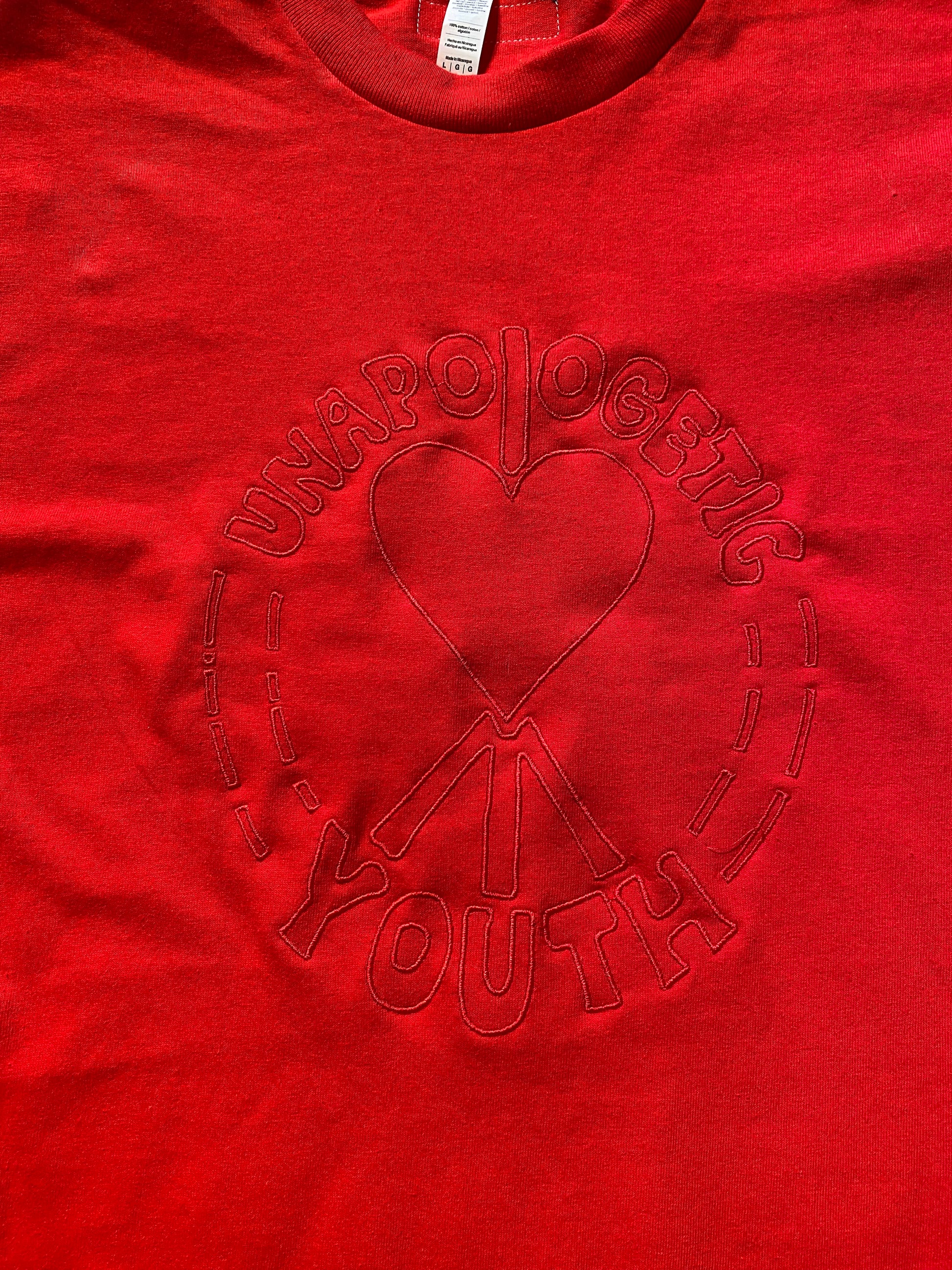 Large Unapologetic Youth T-shirt in white, featuring a casual fit and graphic design on the front.