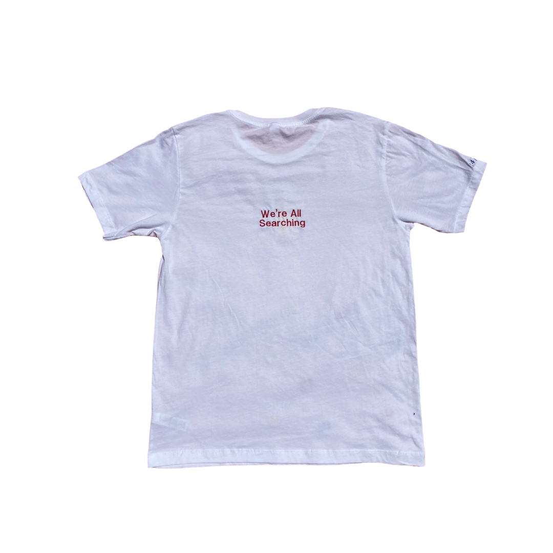 Unapologetic Youth primary T-shirt shown from the back, featuring a simple, casual design in a natural fabric.