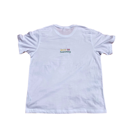 Unapologetic Youth Rasta Mon' T-shirt featuring a colorful Rastafarian-inspired graphic design on the back.