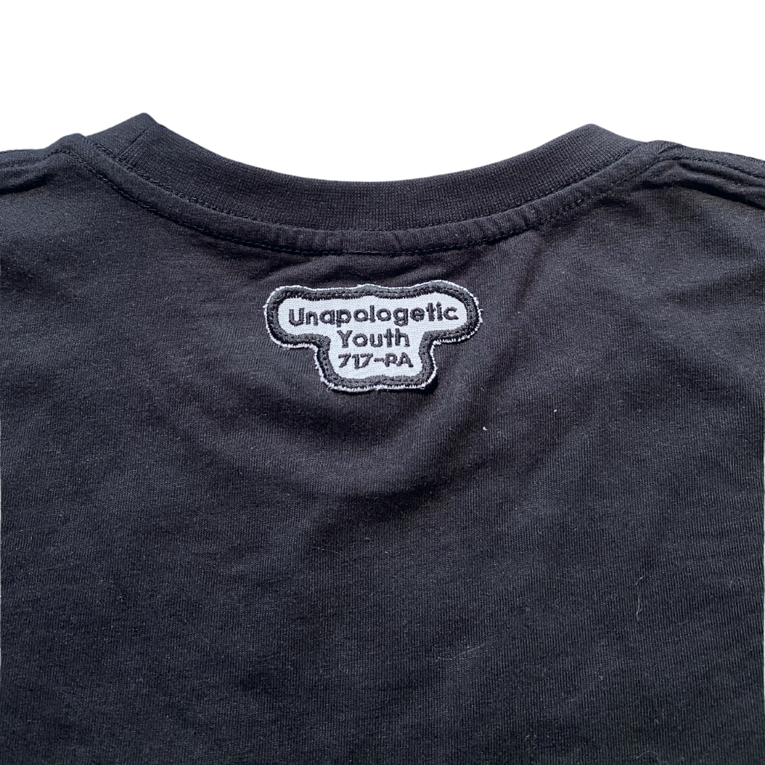 Black Essential Skelly T-Shirt by Unapologetic Youth featuring a bold skeleton graphic on soft cotton fabric.