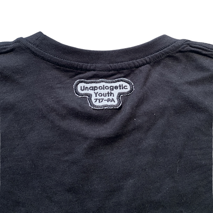Black Essential Skelly T-Shirt by Unapologetic Youth featuring a bold skeleton graphic on soft cotton fabric.