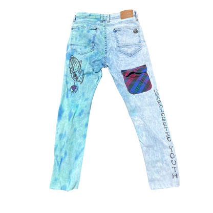 Unapologetic Youth Keep Us Ever Mindful jeans with classic fit and distressed denim, displayed on a neutral background.