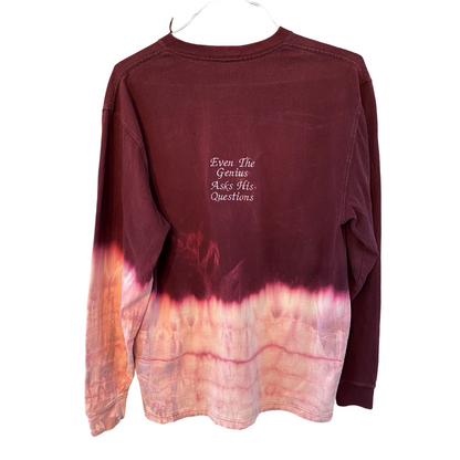 Unapologetic Youth x Carhartt Evil Genius long sleeve shirt with graphic design on front, black fabric, and comfortable fit.