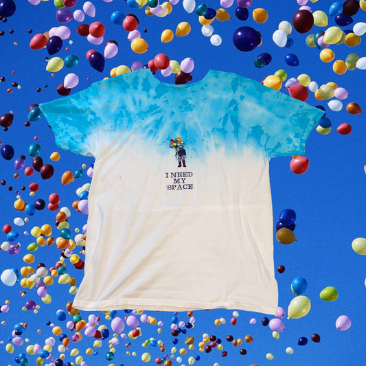 Unapologetic Youth Spaceman Galactica T-shirt featuring a cosmic astronaut design on soft fabric with space-themed artwork.
