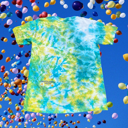 Unapologetic Youth Spaceman Cosmos T-Shirt featuring a space-themed design with a cosmic scene and a spaceman illustration.