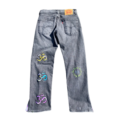 Black Unapologetic Youth jeans, Peace Of Mind style, showing a close-up of the denim fabric and classic fit design.