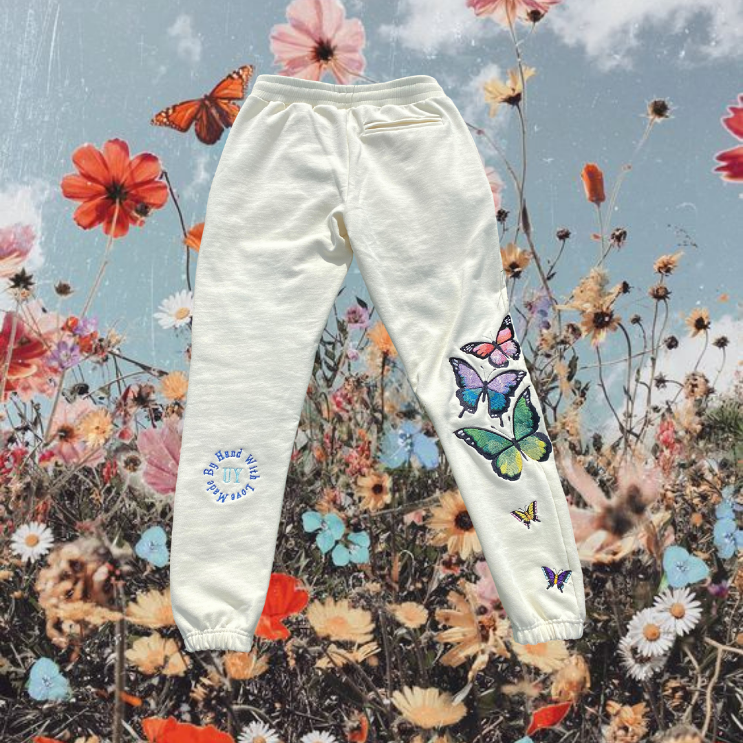 Unapologetic Youth Butterfly Effect sweatpants with vibrant butterfly graphic, relaxed fit, and comfortable fabric for casual wear.