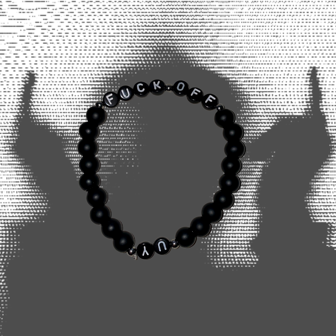 Unapologetic Youth Fuck Off bracelet featuring bold black band and white text, stylish accessory for expressing attitude.