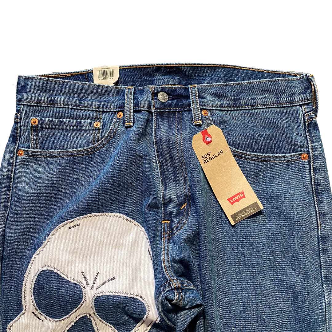 Unapologetic Youth x Levi blue denim jeans from "To The Bone" collection, showing classic fit and detailed stitching.