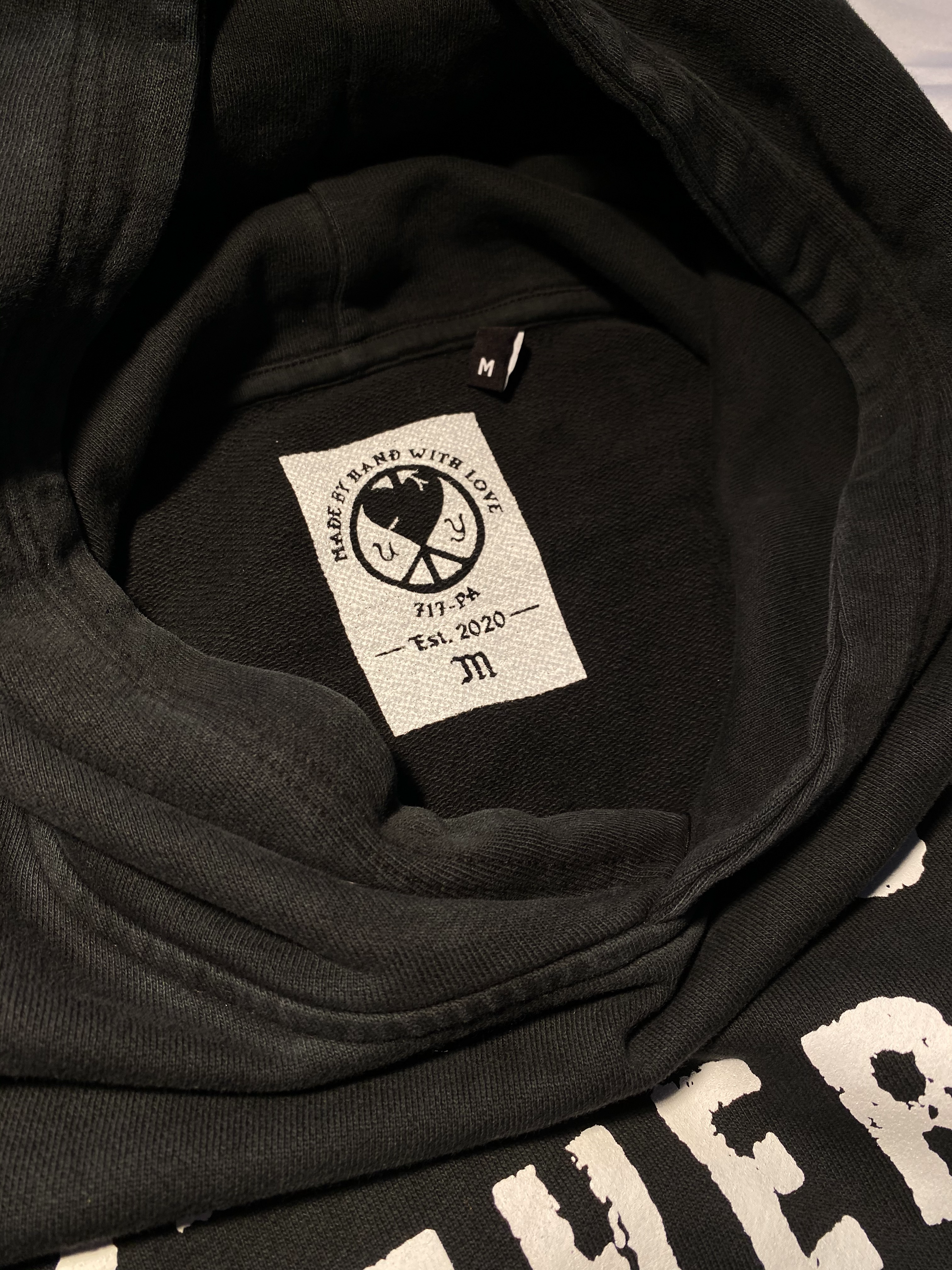 Unapologetic Youth "Are You There?" hoodie featuring bold text, black fabric, and a comfortable casual fit.